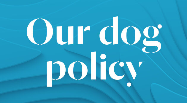 Blue wavy background with white text that reads 'Our dog policy'