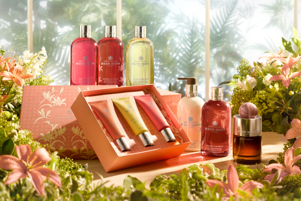 Molton Brown Mothers Day gift in a greenhouse surrounded by green foliage and pink flowers