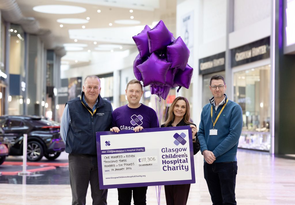 Silverburn staff holding a Glasgow Children's Hospital Charity cheque